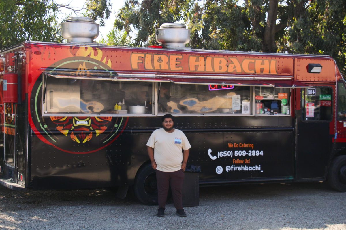 Sanchez poses outside of his "Fire Hibachi" food truck