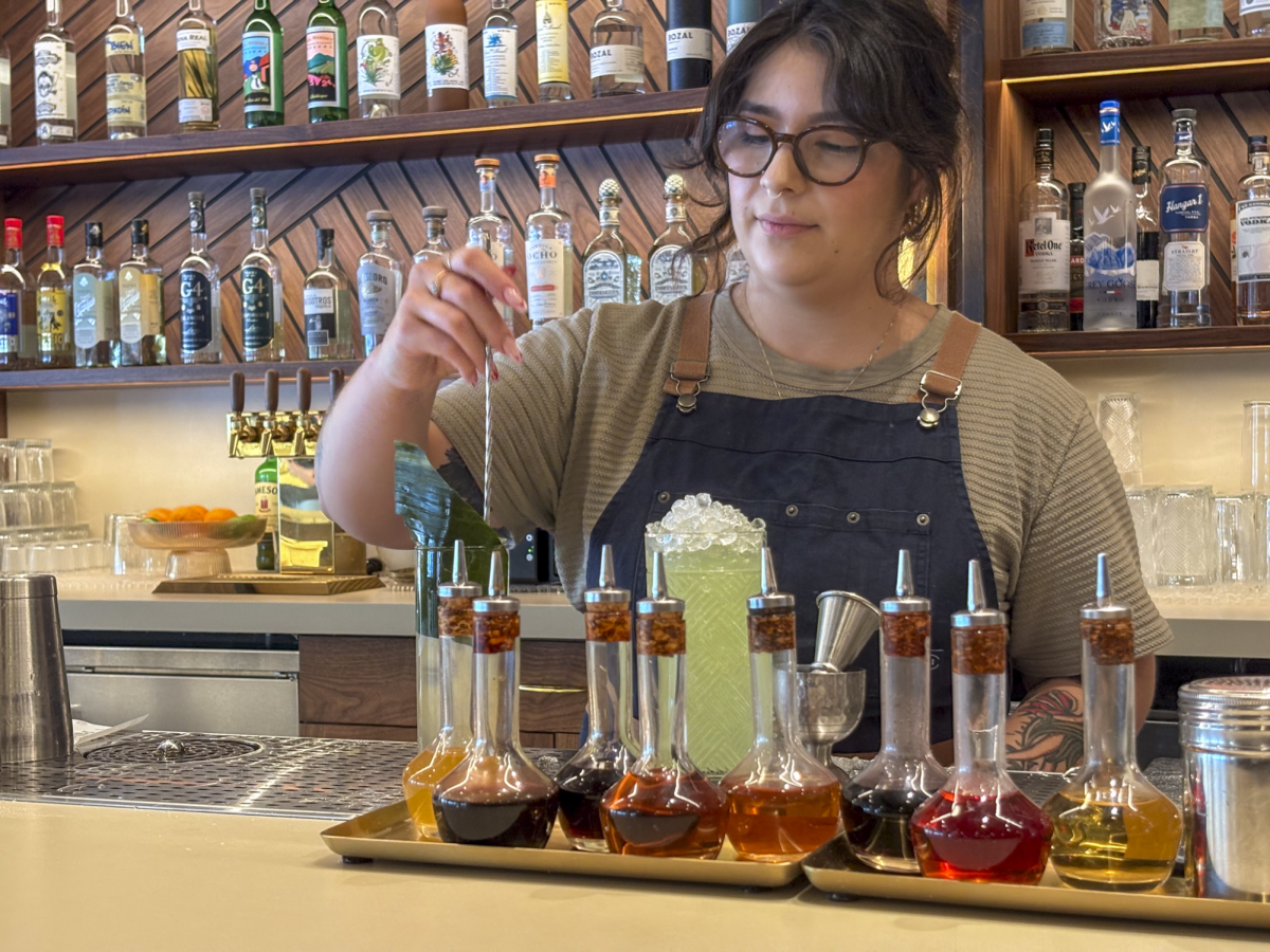 Bartender Juliana Martinez crafts two fruity refreshments. Horsefeather has an expansive selection of drinks, including mocktails.
