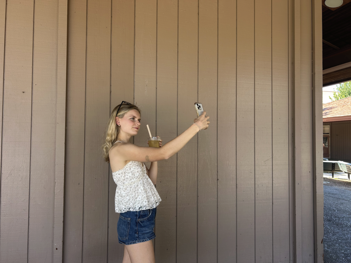 SNAPPING A PHOTO Charlotte Barclay records herself reviewing a drink she bought from Boba Guys for her instagram review page. 